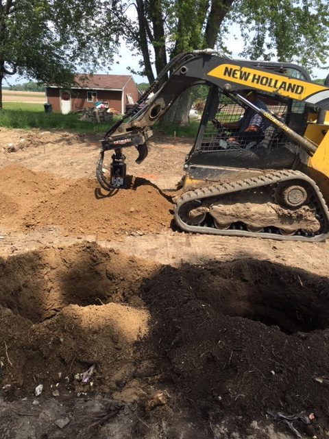 Using skid steer to dig and pour piers